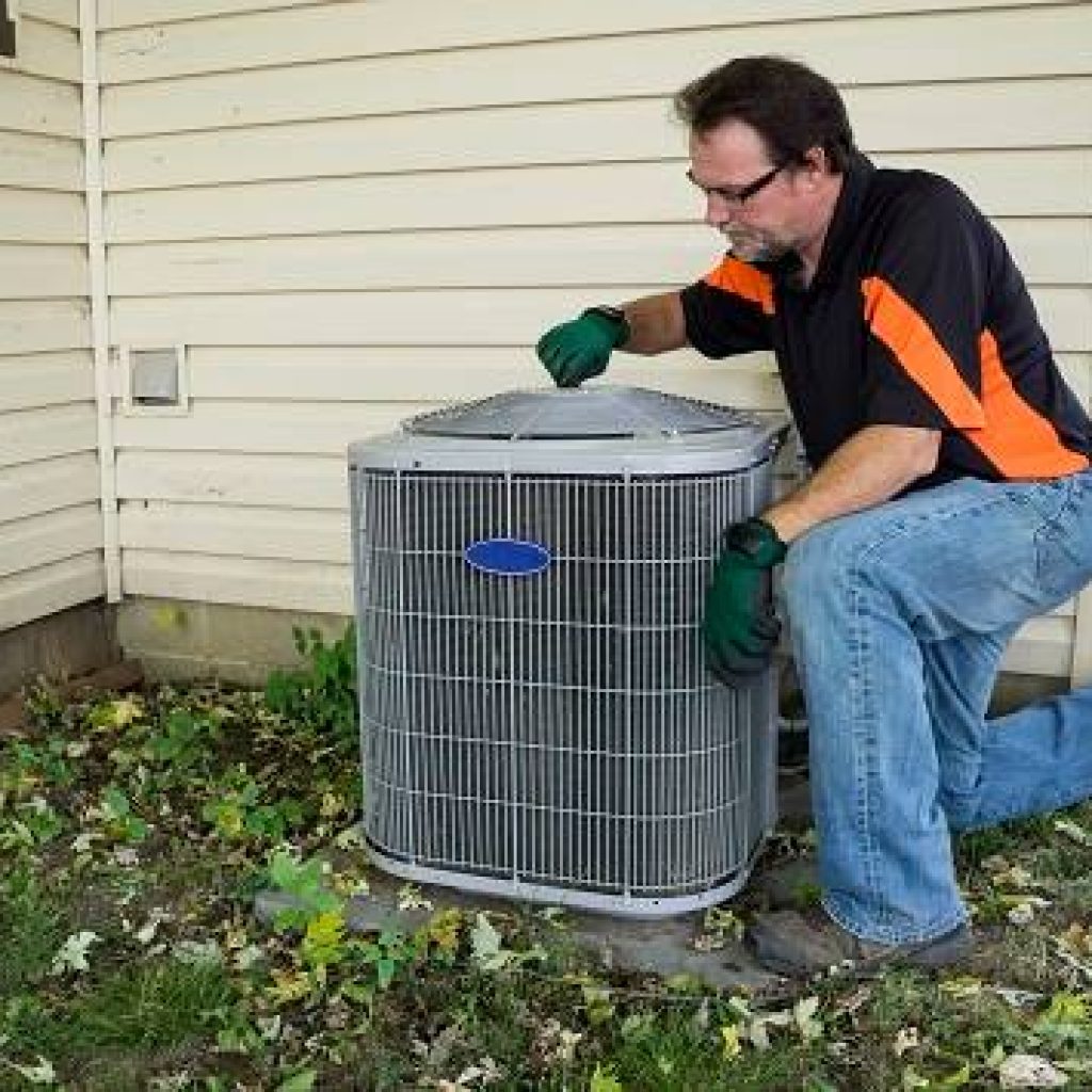 Technician repairing air conditioner in Mississauga, ON